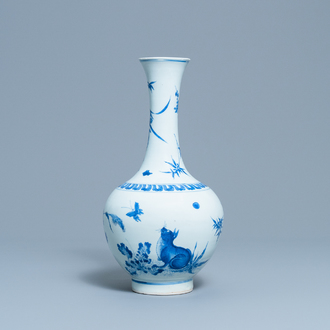 A rare Chinese blue and white bottle vase with a cat and a butterfly, Transitional period