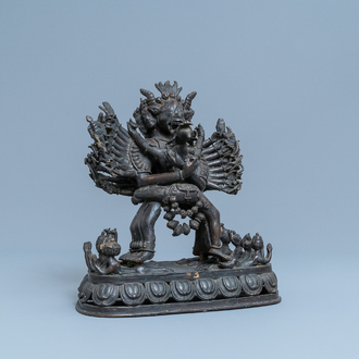 A Tibetan bronze group of Mahakala and his consort Yab-Yum, 19th C.