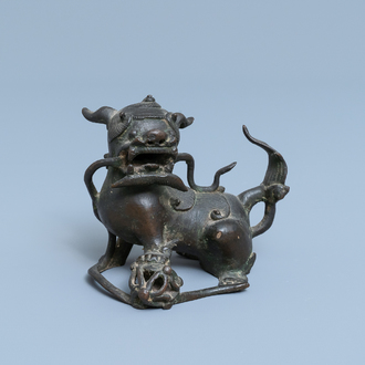 A Chinese bronze model of a Buddhist lion, late Ming