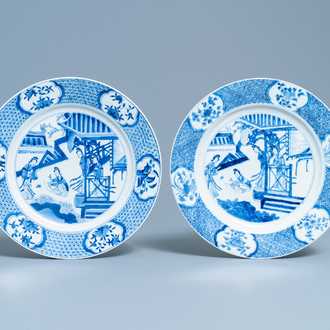 A pair of Chinese blue and white dishes with ladies on a terrace, Chenghua mark, Kangxi