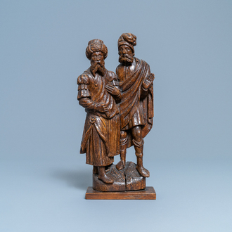 A Flemish carved oak group depicting two jews, probably Antwerp, 16th C.