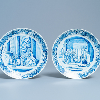 A pair of Dutch Delft blue and white plates with biblical scenes, 18th C.