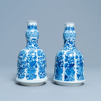 A pair of Chinese blue and white huqqa bases with floral design, Kangxi