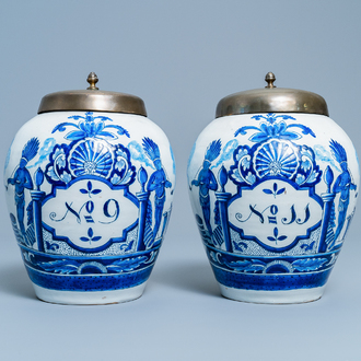 A pair of Dutch Delft blue and white tobacco jars with indians, 18th C.