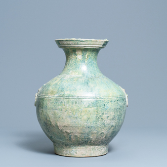 A Chinese monochrome green-glazed jug, Han