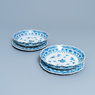 A pair of Dutch Delft blue and white strawberry strainers on stands, 18th C.