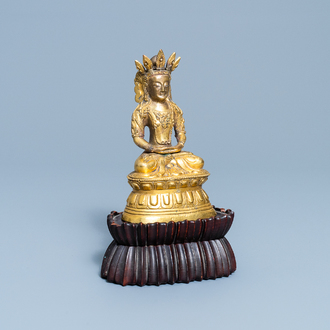 A Sino-Tibetan gilt bronze figure of Buddha, 18th C.