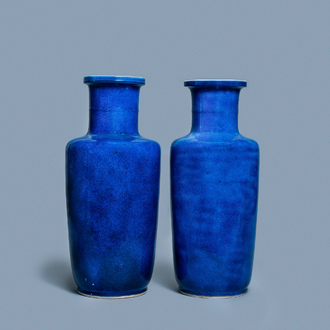 A pair of Chinese monochrome powder blue rouleau vases, Kangxi