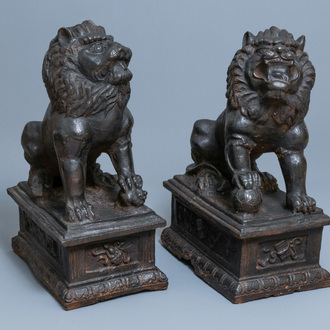 A pair of large Chinese cast iron models of lions, Ming mark and of the period