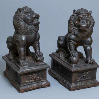 A pair of large Chinese cast iron models of lions, Ming mark and of the period