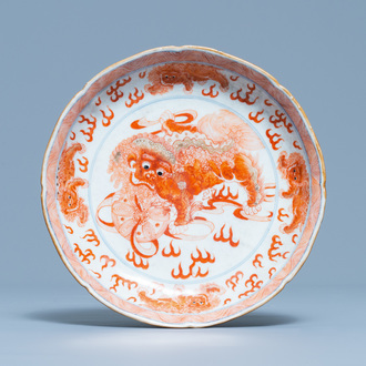 A Chinese blue, white and iron red 'Buddhist lion' dish, Qianlong mark, 19th C.