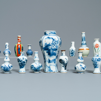 Fifteen Chinese mostly blue and white miniature vases, Kangxi