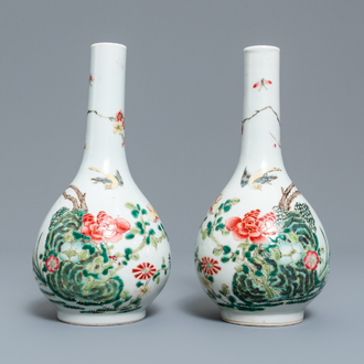 A pair of Chinese famille rose bottle vases, 19th C.