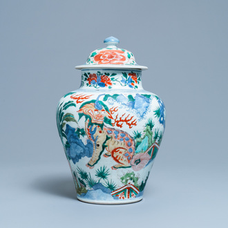 A Chinese wucai 'mythical beasts' vase and cover, Transitional period