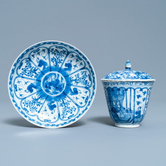 A Chinese blue and white French market covered cup and saucer, Kangxi