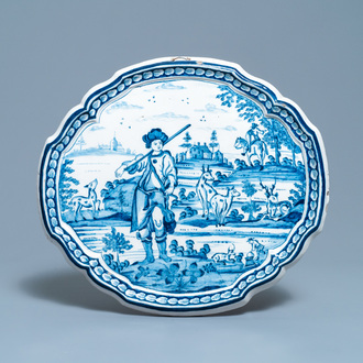 A Dutch Delft blue and white plaque with a hunter, 18th C.
