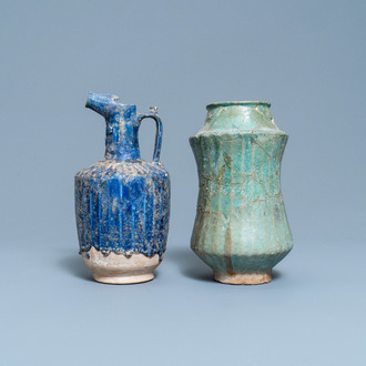 A turquoise-glazed Islamic pottery albarello and a blue-glazed ewer, Iran or Syria, 12/13th C.