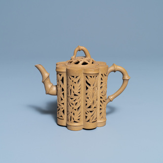 A Chinese reticulated Yixing stoneware teapot and cover, Kangxi