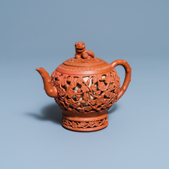 A Chinese reticulated Yixing stoneware teapot and cover, Kangxi