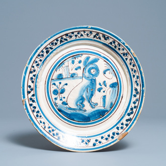 A blue, white and manganese Portuguese faience charger with a rabbit, 17th C.