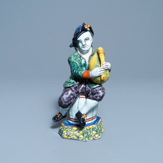 A polychrome Dutch Delft figure of a bagpipe player, 18th C.