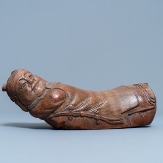 A Chinese bamboo 'recumbent boy' pillow, 19th C.