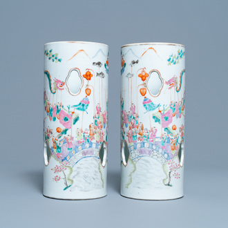 A pair of reticulated Chinese famille rose '100 boys' hat stands, Qianlong mark, 19th C.