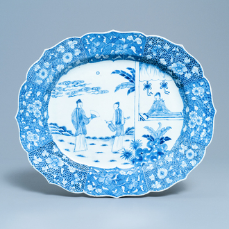 A large oval Chinese blue and white 'Romance of the Western Chamber' dish, Qianlong