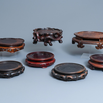 Seven large Chinese carved wooden stands, 19/20th C.