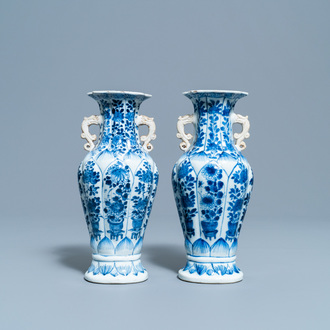A pair of Chinese blue and white vases with floral design, Kangxi