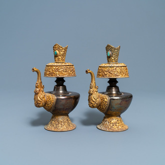 A pair of Tibetan silver and gilt copper alloy 'duomuhu' ewers, 19th C.