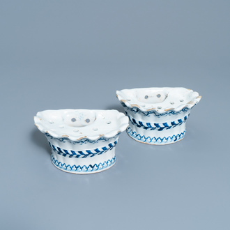 A pair of blue and white French faience bouquetières or wall flower holders, Lille, 18th C.