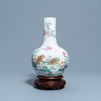 A Chinese famille rose bottle vase with quails, Qianlong mark, 19th C.