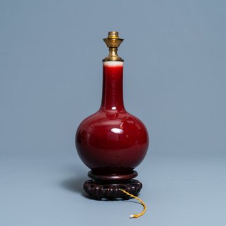 A Chinese monochrome sang de boeuf lamp-mounted bottle vase, 19/20th C.
