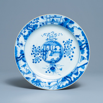 A Chinese blue and white dish with raised central medallion, Kangxi