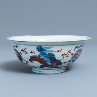 A Chinese blue, white and copper red bowl with Buddhist lions, Qianlong mark, 19th C.