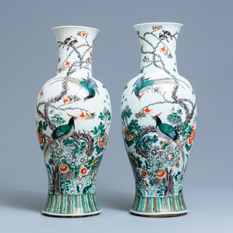 A pair of Chinese famille verte vases with birds among blossoming branches, 19th C.