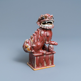 A Chinese monochrome sang de boeuf model of a Buddhist lion, 19th C.