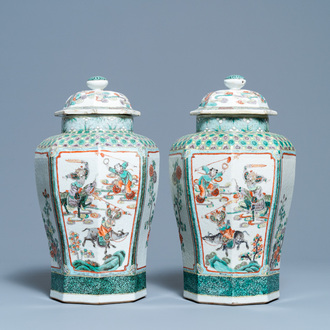 A pair of Chinese octagonal famille verte vases and covers, 19th C.