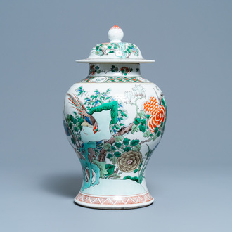 A Chinese famille verte vase and cover, Kangxi mark, 19th C.