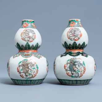 A pair of Chinese famille verte double gourd 'dragon' vases, 19th C.