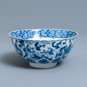 A Chinese blue and white lotus-molded 'playing boys' bowl, Chenghua mark, Kangxi