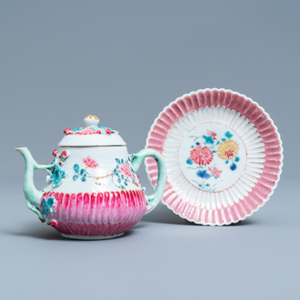 A Chinese famille rose teapot on stand with applied floral design, Yongzheng