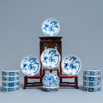 A pair of Chinese blue and white four-tier stacking boxes, a seal paste box and four saucers, 19th C.