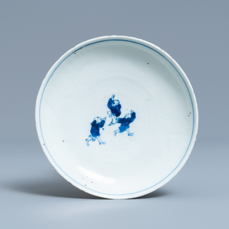 A Chinese blue and white ko-sometsuke plate with three playing boys for the Japanese market, Transitional period