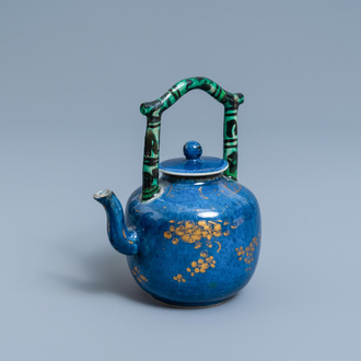 A Chinese powder blue and gilt teapot with verte biscuit handle, Kangxi