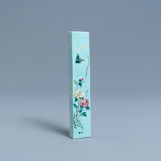 A Chinese famille rose relief-decorated scroll weight, hall mark, 19th C.