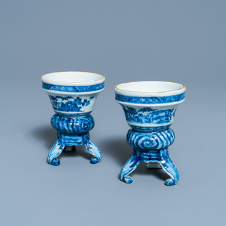 A pair of Chinese blue and white rococo-style tripod salts, Qianlong