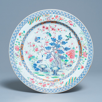 A large Chinese famille rose dish with birds among blossoming branches, Qianlong