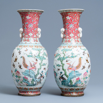 A pair of Chinese famille rose 'phoenix' vases, Tongzhi mark and of the period